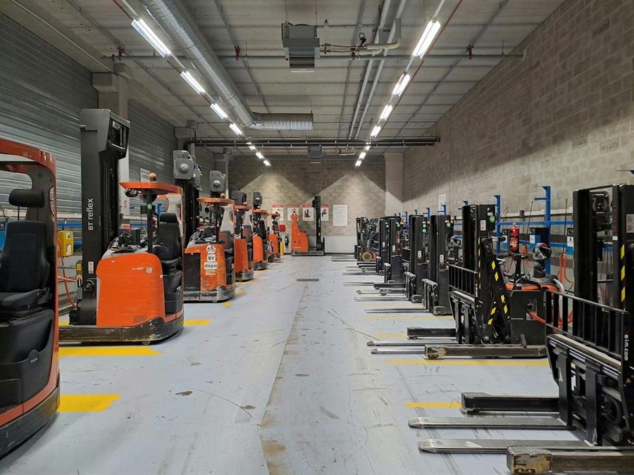 Forklifts in a large warehouse fleet