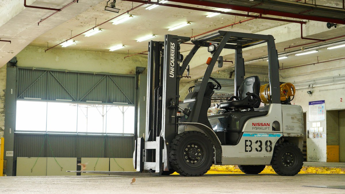 Forklift parked inside an industrial warehouse