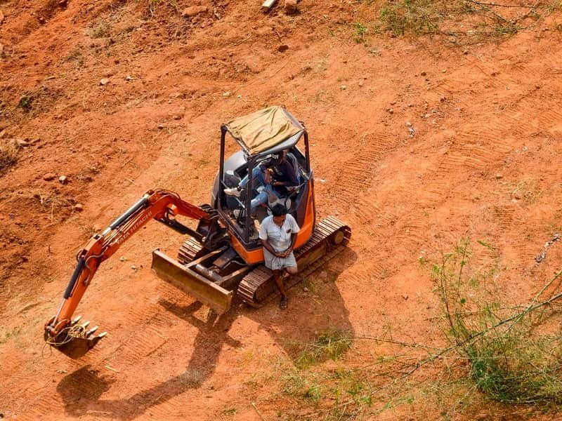1.2 Ton Mini Excavator: QS-12 for Tight Access - mini excavator working on a construction site