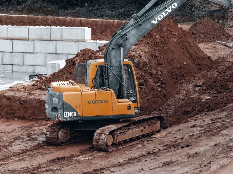 Can a Mini Excavator Remove Stumps? - mini digger working on site