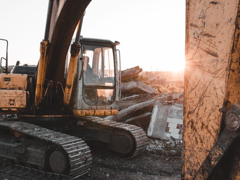 How to Drive a Mini Excavator: Beginner’s Guide - excavator digging and earthmoving