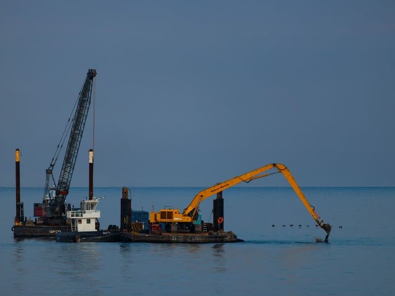 How to Secure a Mini Excavator to a Trailer - excavator maintenance and undercarriage inspection