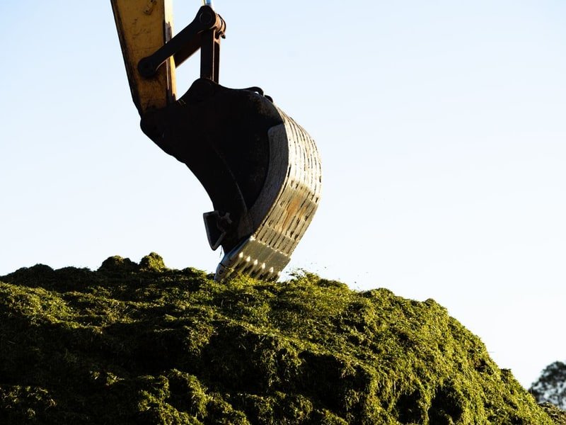 Lease a Mini Excavator: Costs and Lease-to-Own - mini excavator attachment in use