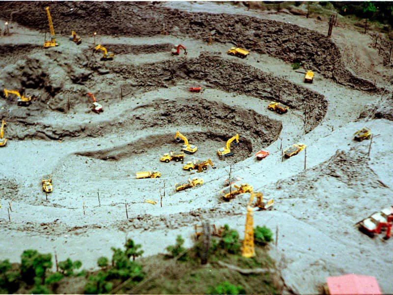 Mini Compact Excavator: Size and Access Guide - mini excavator working on a construction site