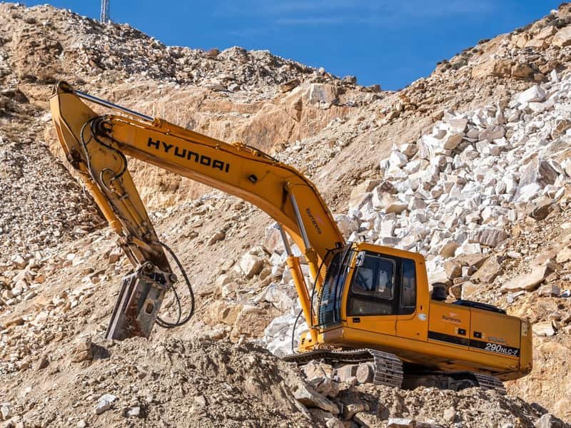 How Much Can a Mini Excavator Lift? Capacity by Size and Reach - excavator digging and earthmoving