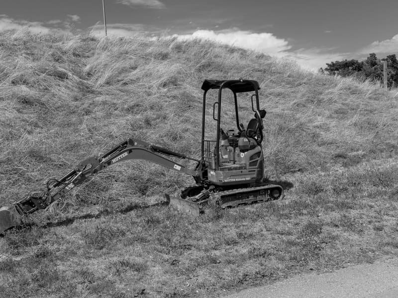 Mini Excavator Prices by Size: 1-2.5 Ton Guide - mini excavator working on a construction site