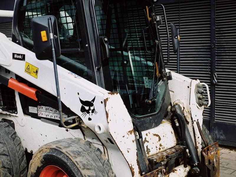 New vs Used Mini Excavator Cost: Which Is Better? - compact excavator at a construction site