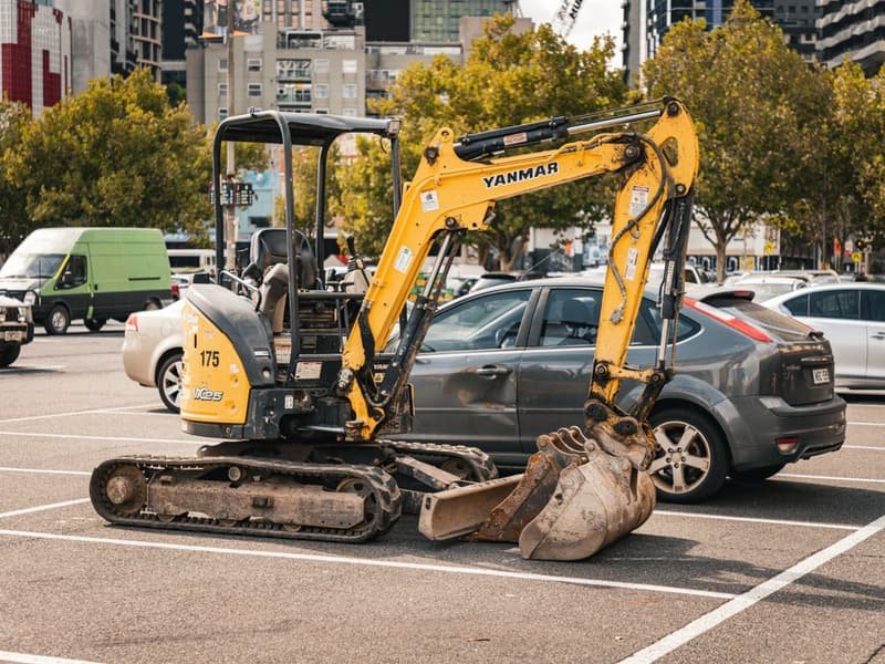 Small Excavator for Sale: Size and Price Guide - mini excavator working on a construction site