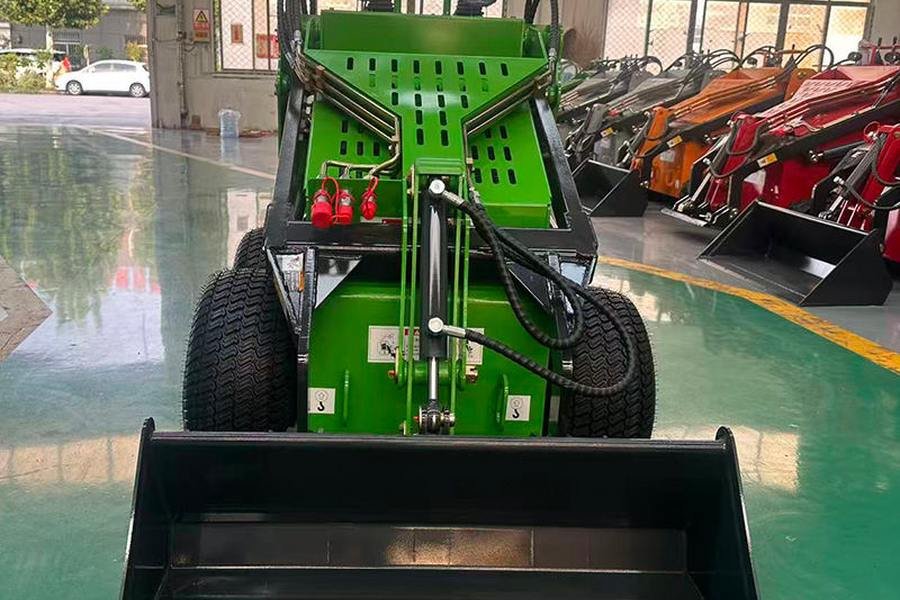 QS-330 mini skid steer loader front view with bucket