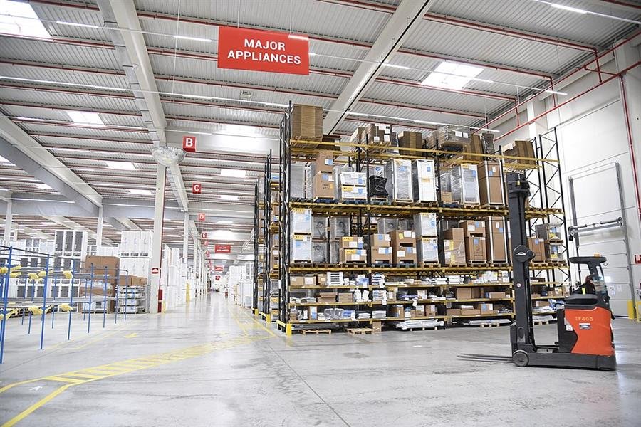 Reach truck in a logistics warehouse during an XPO facility visit